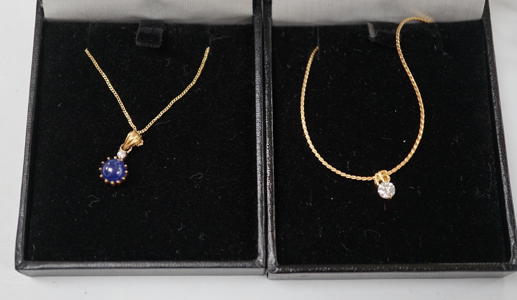 A modern 18k and solitaire diamond set necklet, 36cm, together wit a modern Italian Uno-A-Erre 18k, cabochon sapphire and diamond set necklet, 46cm, gross weight 7 grams. Condition - good